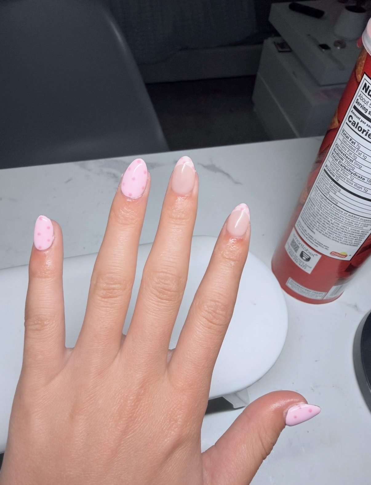 Micro-French champagne nail inspiration with pink dotted accents by Raegan